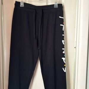 Black sweatpants Friends on left leg